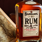 **Image Prompt:** A close-up, warmly lit shot of a Mount Gay rum bottle, perhaps the XO expression. The bottle should be set against a blurred background depicting a vintage map of Barbados and possibly some aged, leather-bound books. The overall mood should evoke a sense of history, craftsmanship, and the allure of the Caribbean. Consider adding subtle details like a glint of light on the rum, suggesting its rich color and texture.