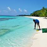바베이도스 관광 산업의 도전과 기회 - **Sustainable Tourism:** "A picturesque view of a Barbadian beach being cleaned by volunteers, lush ...